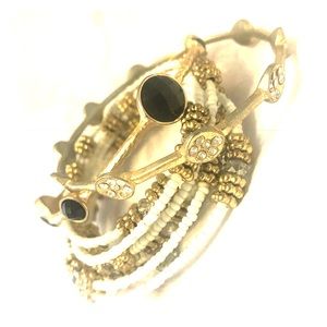 Bundle of three bracelets gold/white/black